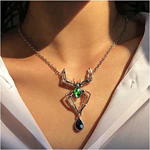 Collar de araña plateado con gemas verdes y negras